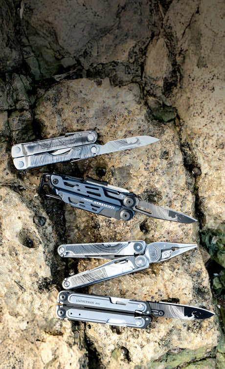 Translation missing: en.Four customized Leatherman multitools showing designs by The Minimalist Wave created for World Artist Day