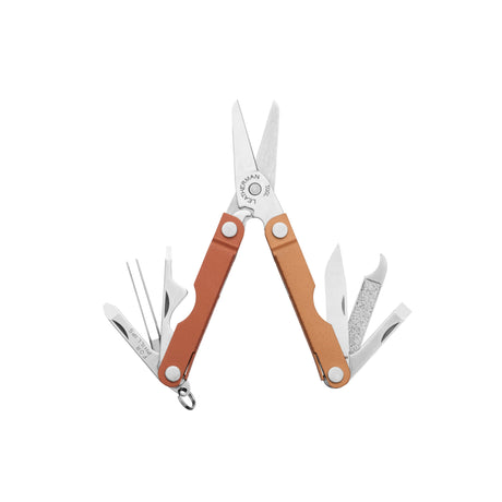 Translation missing: fr.Leatherman Micra multi-tool in a Pumpkin Spice color, shown fully open to reveal its tools including scissors, nail file, knife, tweezers, screwdrivers, and bottle opener, all with a compact and functional design