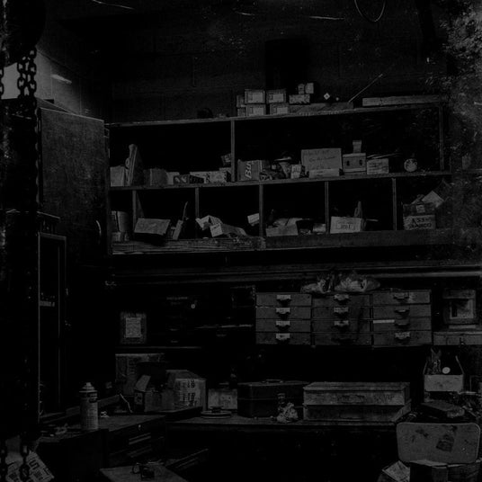 Translation missing: en.Cluttered storage room with various boxes, containers, and items on shelves