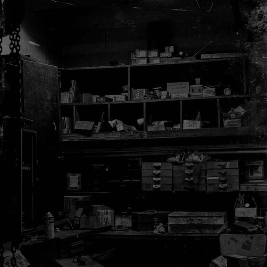 Translation missing: en.Cluttered storage room with various boxes, containers, and items on shelves
