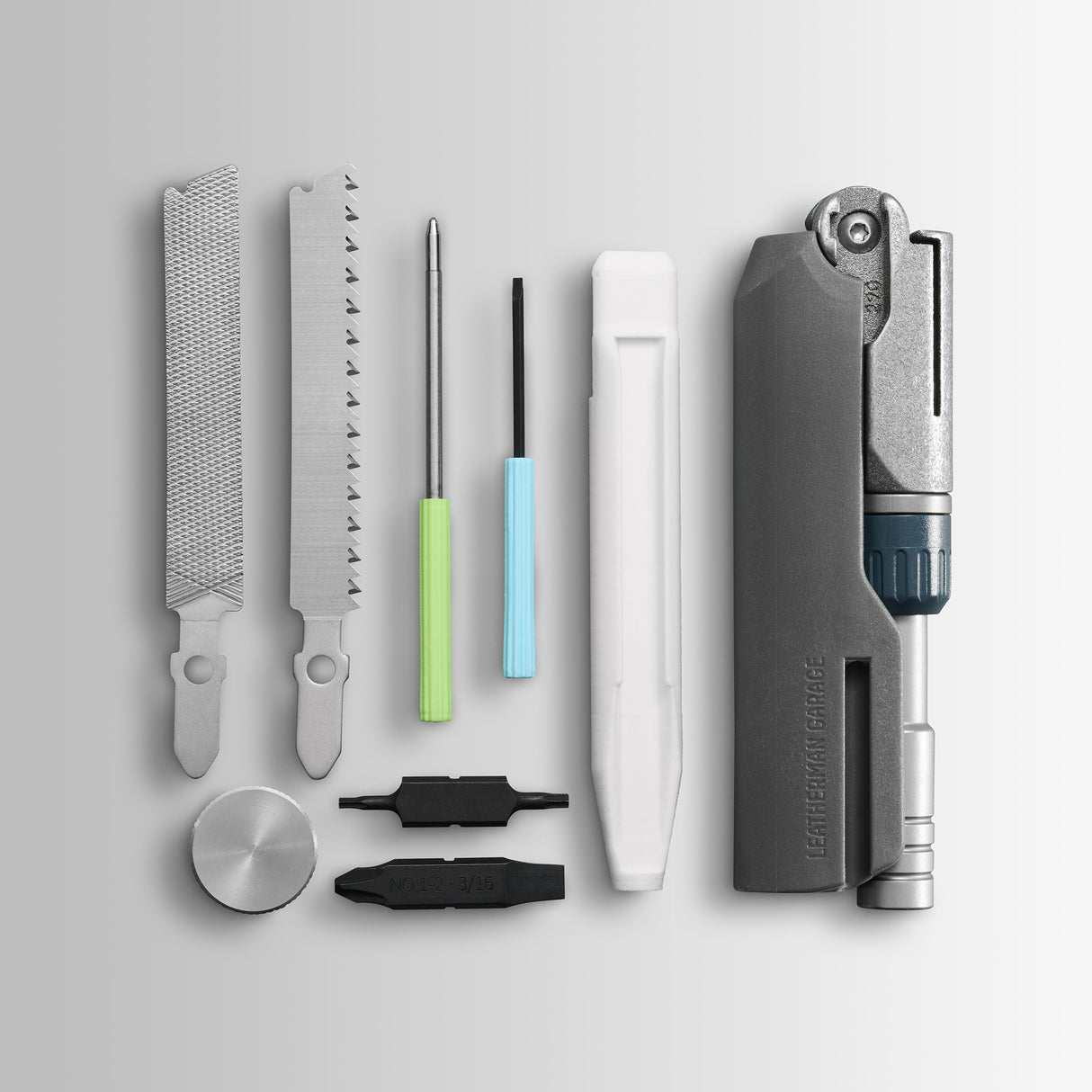 Translation missing: fr.Batch #009: Adapter multitool components laid out, including files, saw, drivers, bits, and main tool body