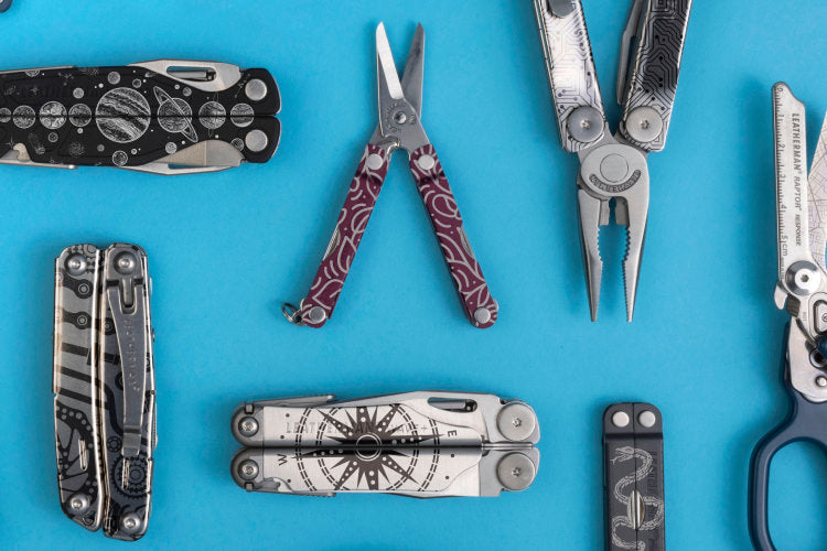 Translation missing: it.An assortment of customized Leatherman tools on a blue background