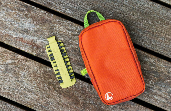 Translation missing: pl.Leatherman Aurora tool pouch with a Mojito bit kit on wooden surface