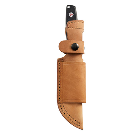 Leatherman Trac Jet Black fixed-blade knife sheathed in a tan leather belt sheath with black snap closures, displayed on a white background.
