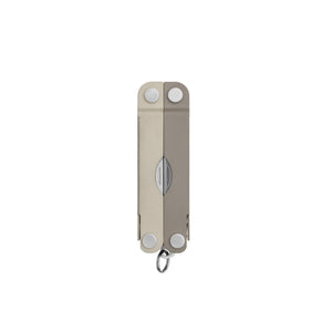 Translation missing: es.Closed Leatherman Micra multi-tool in Winter Fog color, featuring a compact, dual-tone beige and grey design with a keychain loop