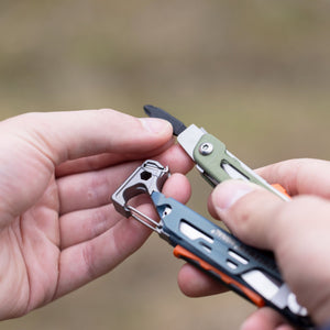 A person holding Leatherman Signal in their hand, showcasing bit driver and bit.