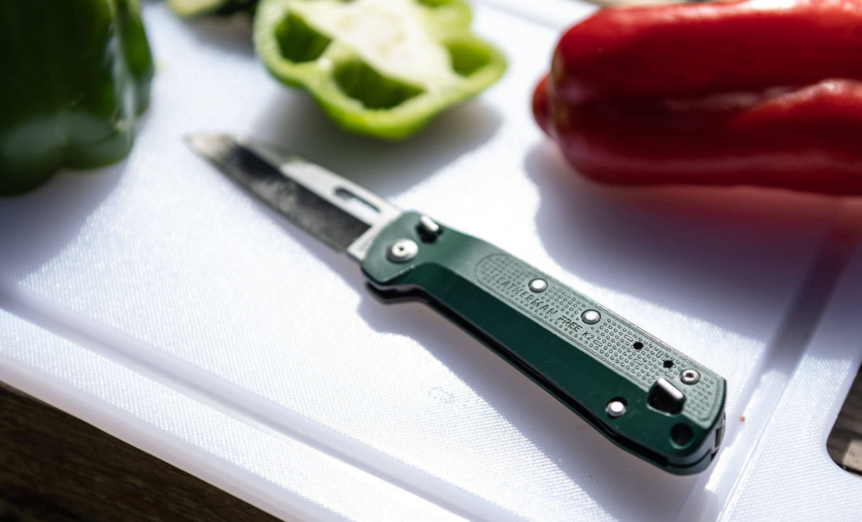 K2 on a cutting board surrounded by vegetables