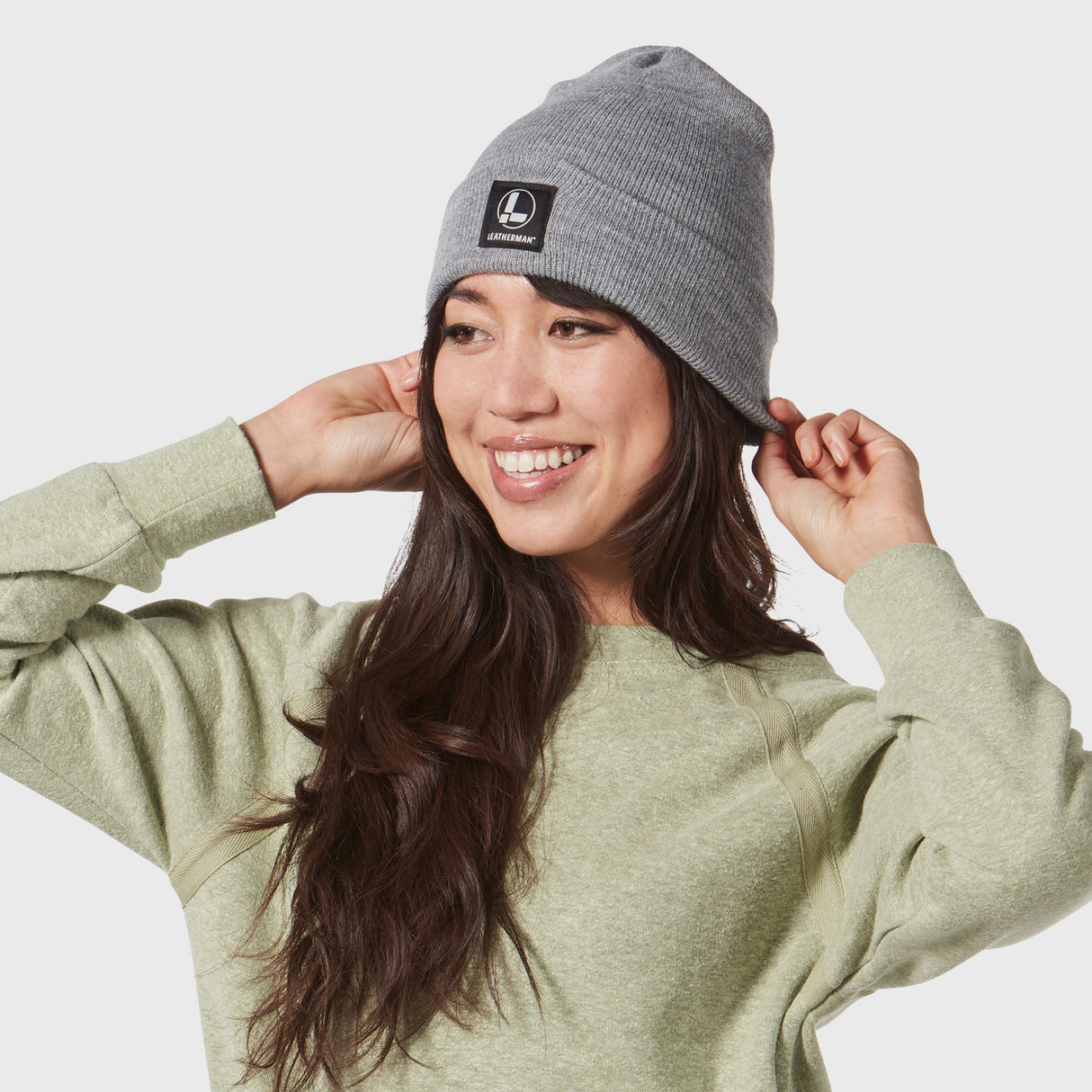 woman wearing gray leatherman beanie