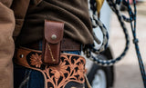 Man in wearing brown hoodie with Leatherman Heritage Sheath on belt