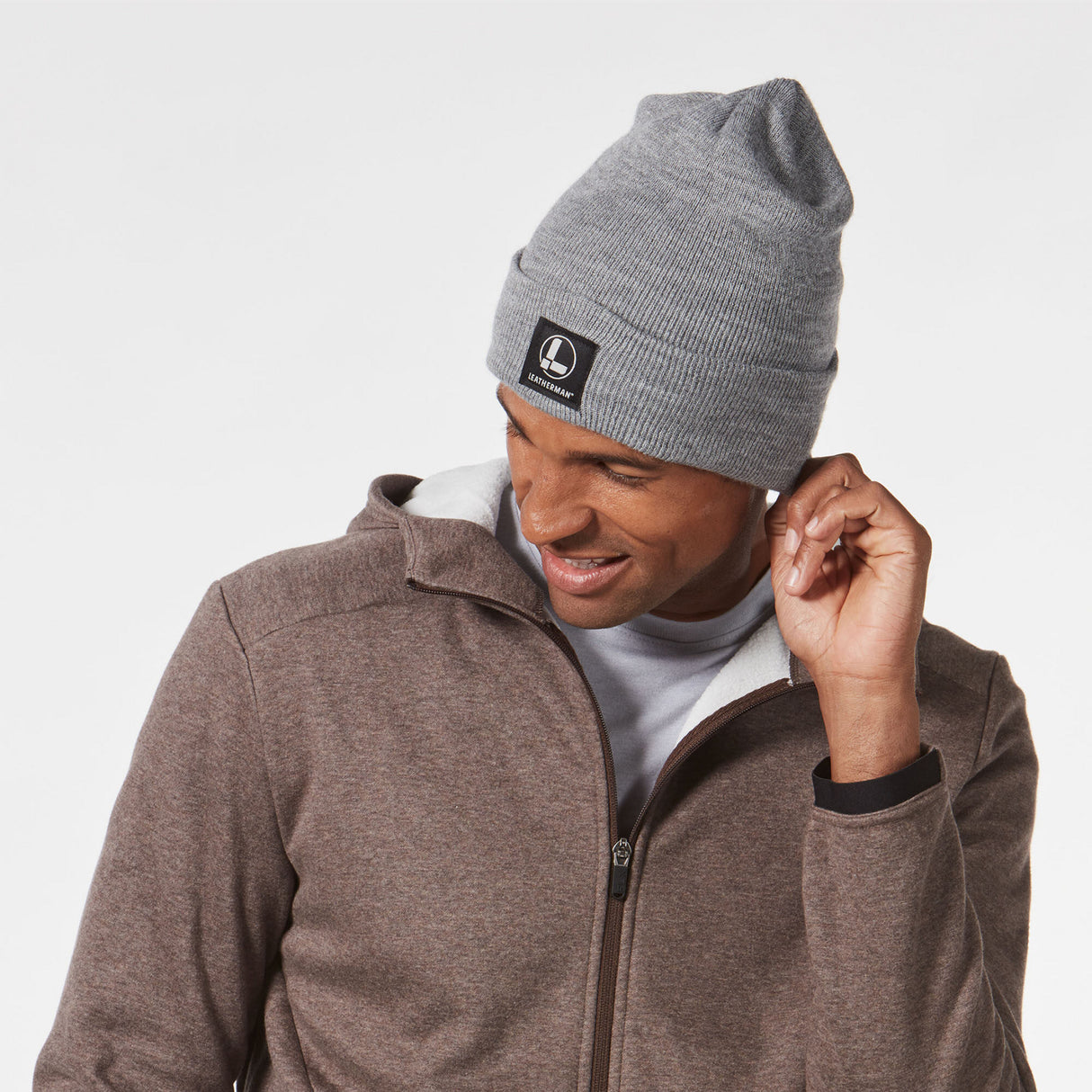 Man wearing gray leatherman beanie