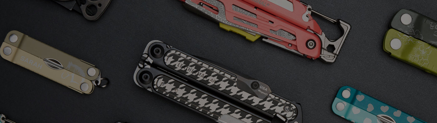 A selection of Leatherman multi tools featuring different styles and sizes, is showcased on a table for viewing.