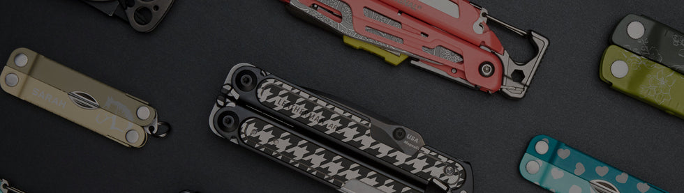 A selection of Leatherman multi tools featuring different styles and sizes, is showcased on a table for viewing.
