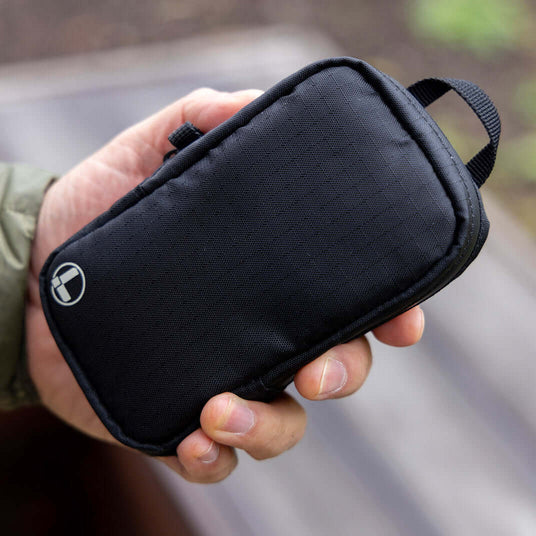 Translation missing: da.Black Leatherman Tool Pouch held in hand, showcasing a sleek and durable design perfect for organizing tools