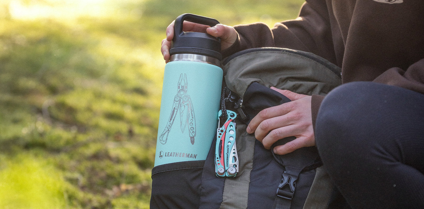 A Yeti bottle paired with a Paradise Skeletool CX multi-tool attached to a backpack, perfect for outdoor adventures.