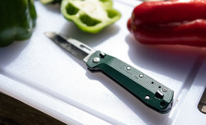 Translation missing: en.K2 on a cutting board surrounded by vegetables