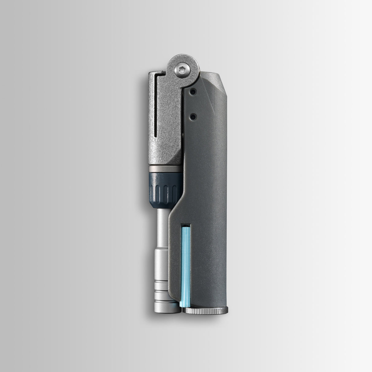 Translation missing: es.Batch #009: Adapter shown folded, with metallic and dark gray components and a slim cylindrical insert