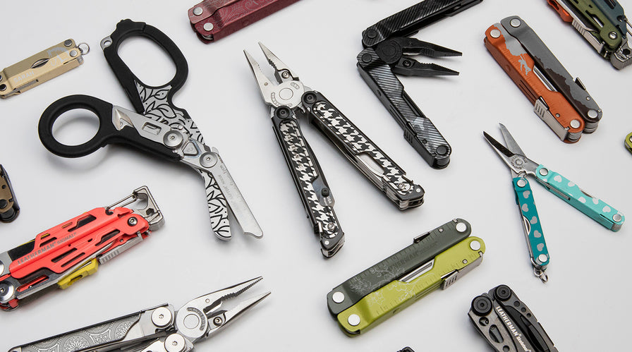 An assortment of Leatherman multi-tools arranged on a table, highlighting their diverse shapes and features.