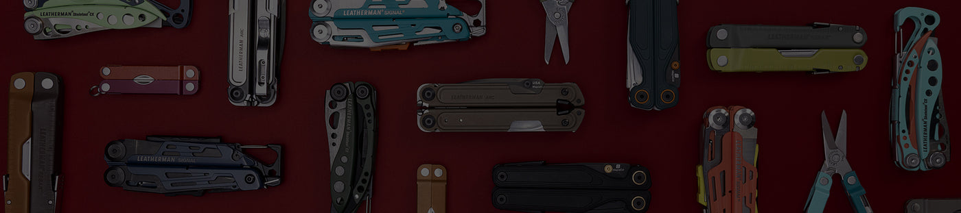 Translation missing: de.A variety of Leatherman tools in different styles are arranged on a vibrant red surface