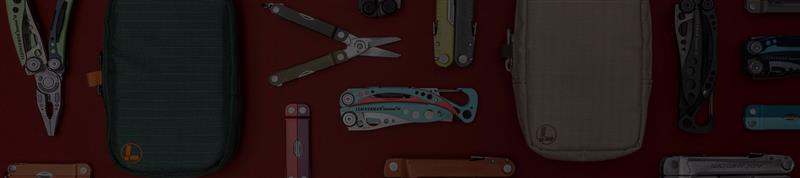 Translation missing: es.A variety of Leatherman tools in different styles are arranged on a vibrant red surface