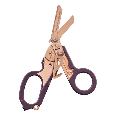 Translation missing: pl.Raptor® Rescue shears in Rose Gold with purple handles, shown open to display blades and integrated tools